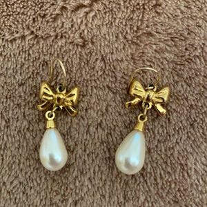 Gold and pearl pierced earrings.
